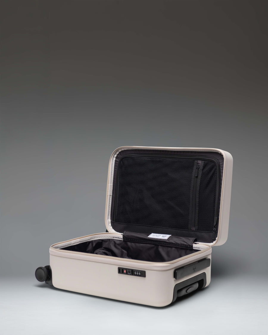 Herschel Heritage Hardshell Carry On Luggage in the off-white Moonbeam colorway.