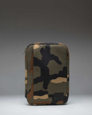 Herschel Burrard Organizer Tech in woodland camo pattern, showing the open layout with slots and compartments for tech accessories.