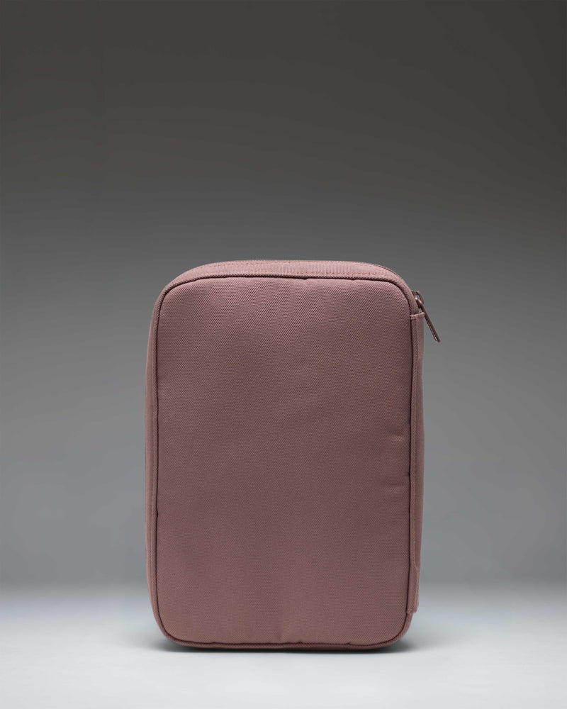 Herschel Burrard Organizer Tech pouch in Ash Rose Tonal, open to show interior mesh pockets and elastic loops for organizing cables.