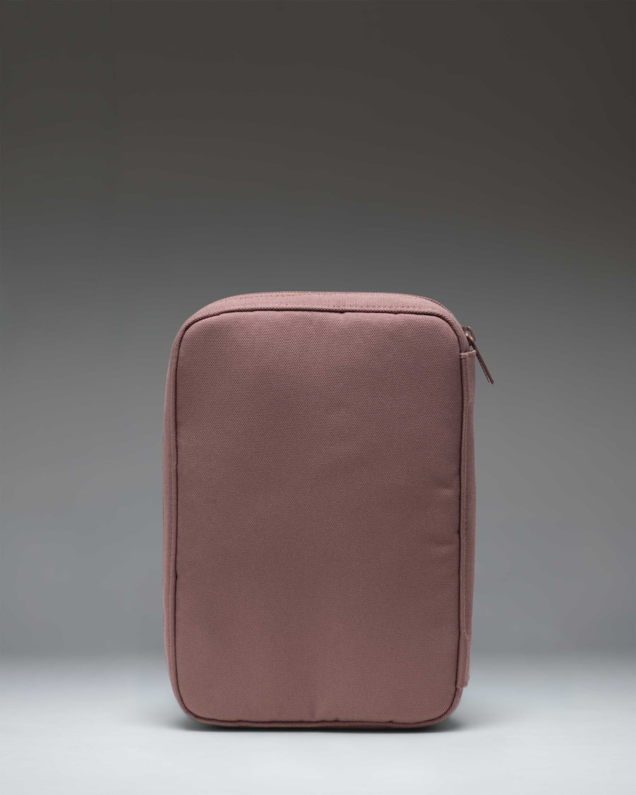 Herschel Burrard Organizer Tech pouch in Ash Rose Tonal, open to show interior mesh pockets and elastic loops for organizing cables.