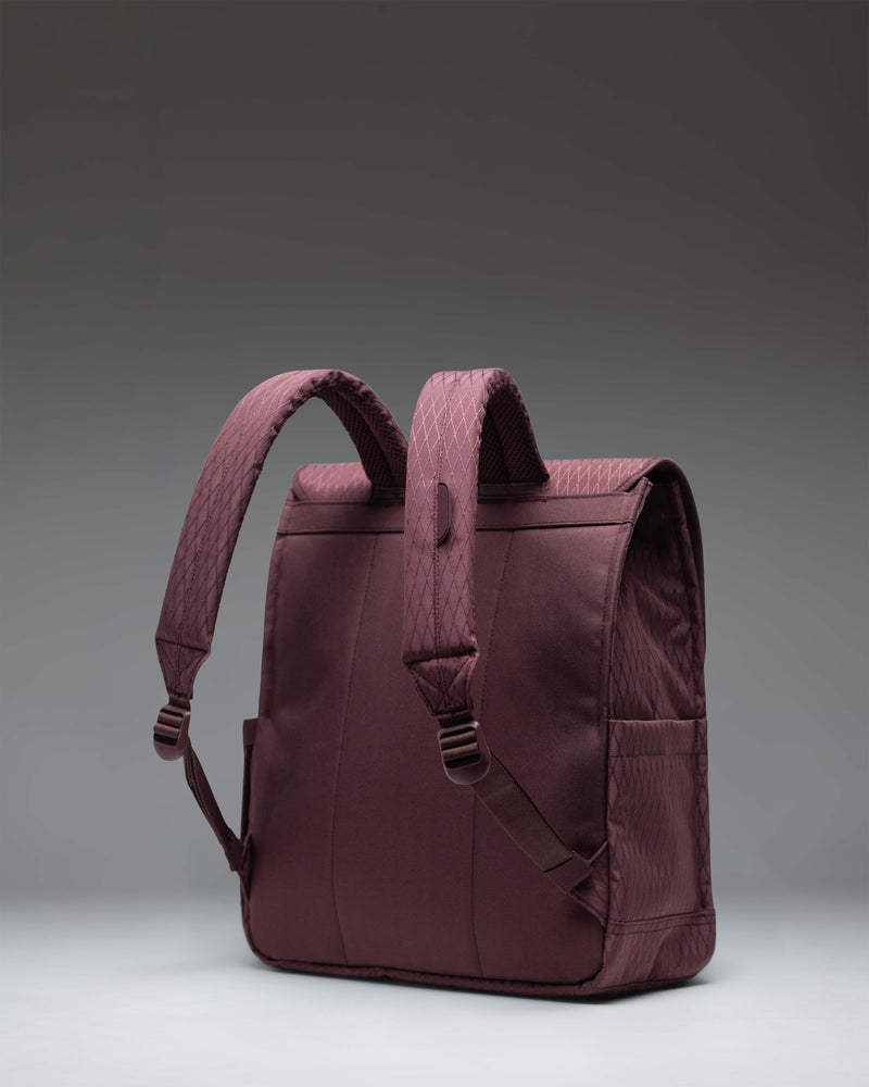 Herschel Supply Co. City Backpack in Huckleberry Diamond with a single front magnetic strap closure and clean, slim design.