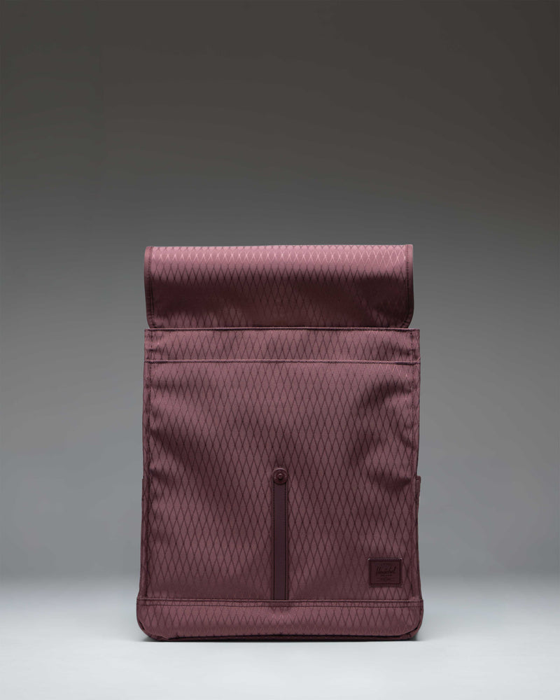 Herschel Supply Co. City Backpack in the Huckleberry Diamond color pattern featuring a single front strap closure with a metal pin buckle.