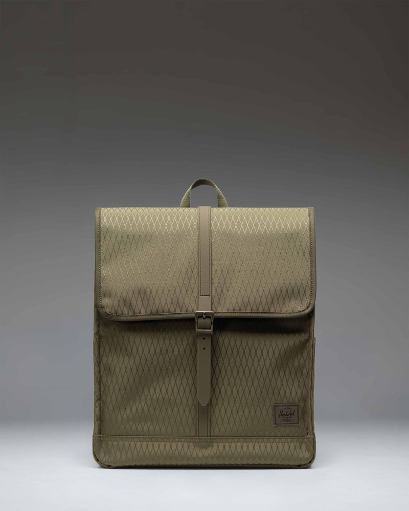 Herschel Supply Co. City Backpack in Ivy Green Diamond pattern featuring a slim design with a single strap closure and a front storage sleeve.