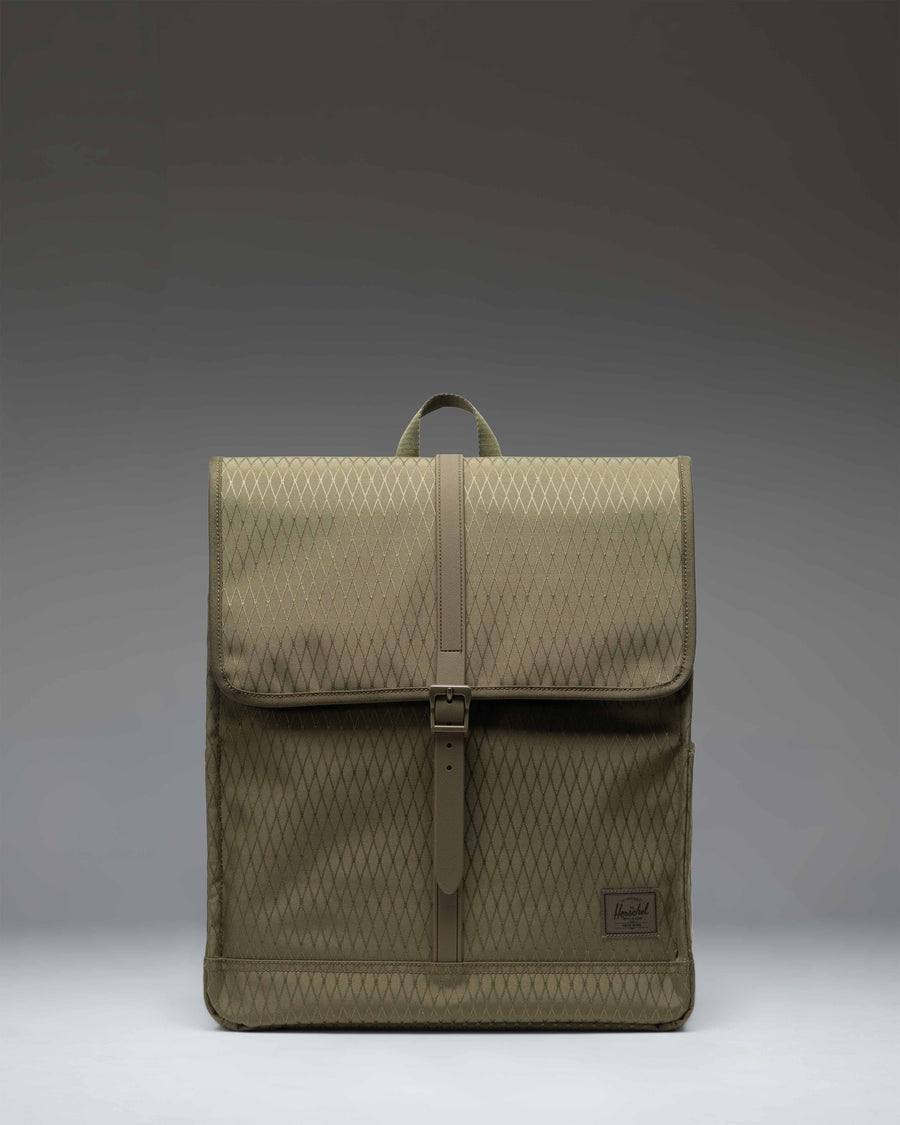 Herschel Supply Co. City Backpack in Ivy Green Diamond pattern featuring a slim design with a single strap closure and a front storage sleeve.
