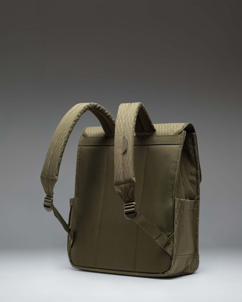 Herschel Supply Co. City Backpack in Ivy Green Diamond pattern featuring a clean, minimalist design with a single strap magnetic closure.