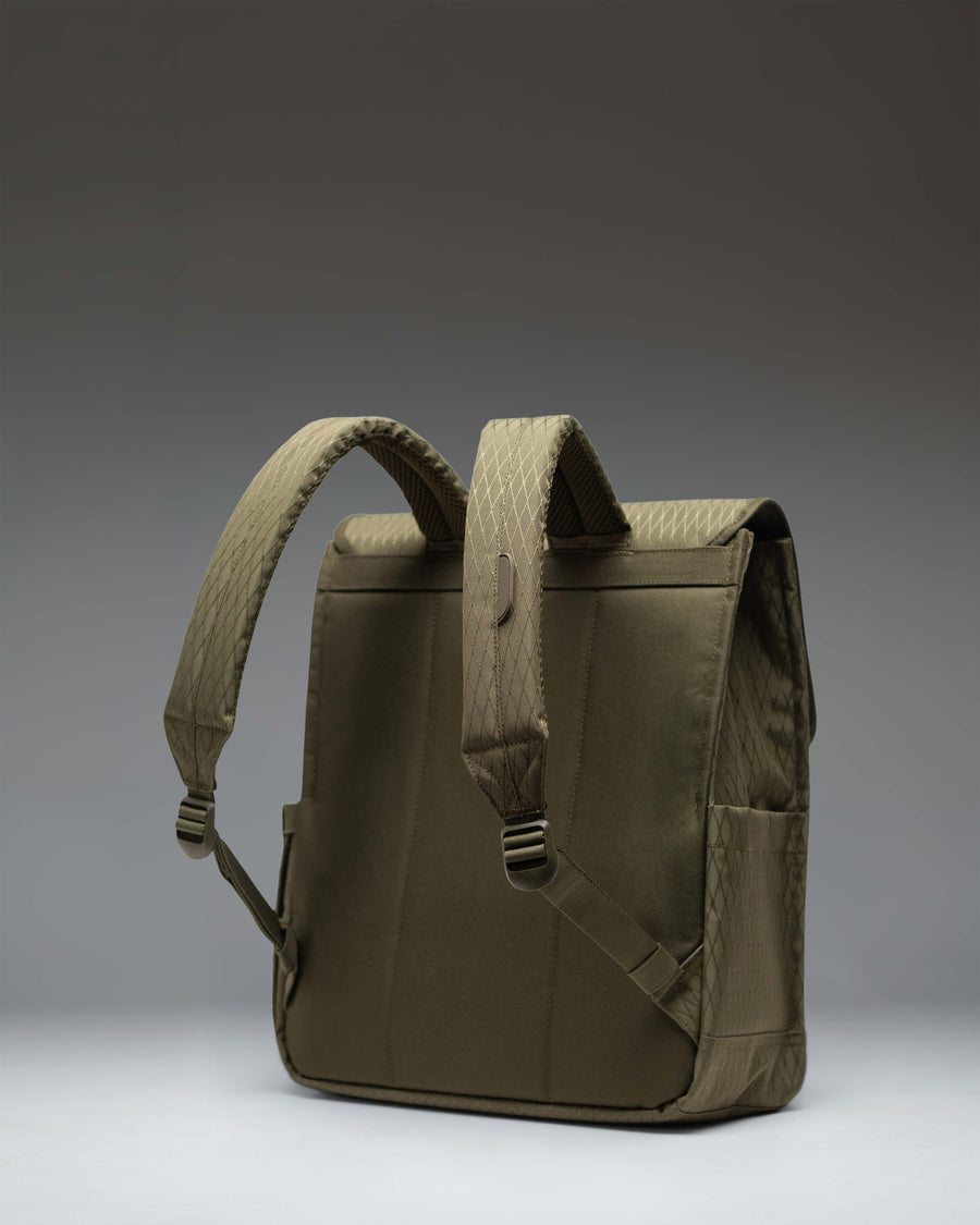 Herschel Supply Co. City Backpack in Ivy Green Diamond pattern featuring a clean, minimalist design with a single strap magnetic closure.