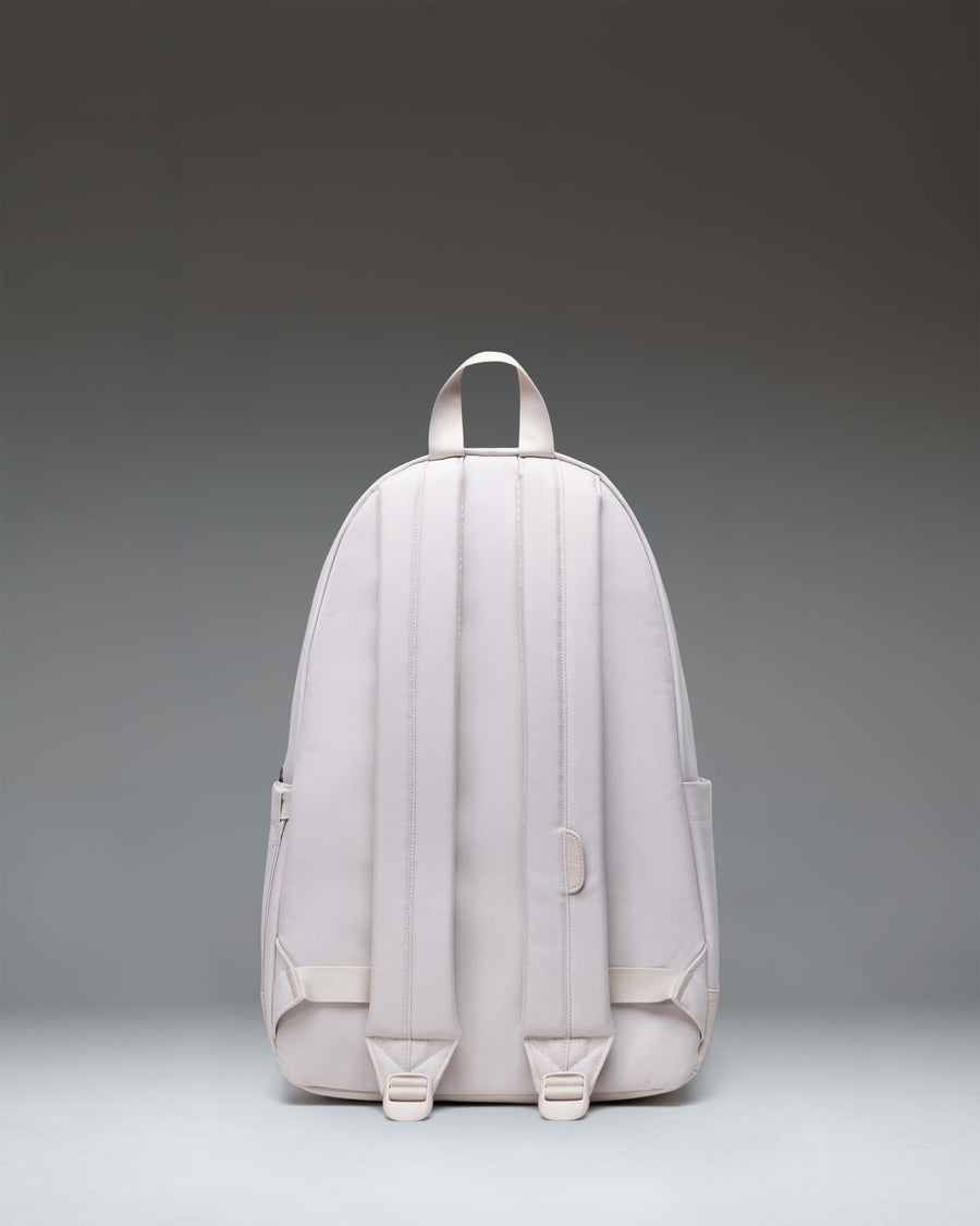 Herschel Heritage Backpack in Moonbeam color shown from the front highlighting its signature diamond detail and front pocket organizer.