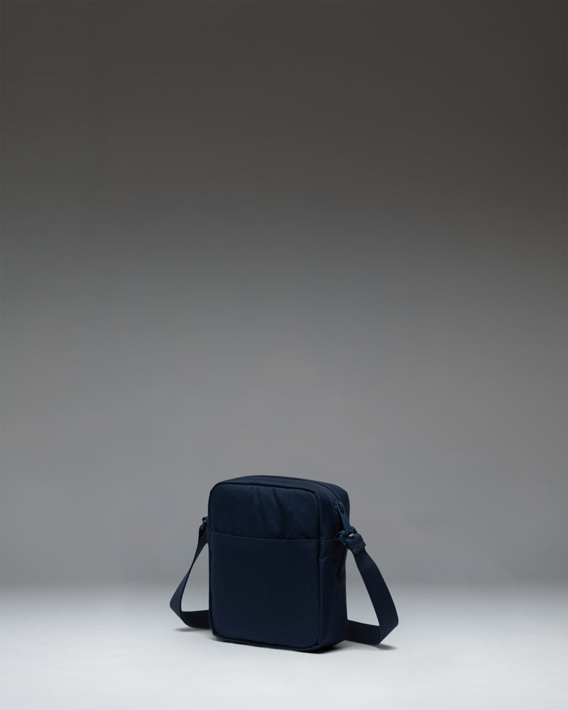 Herschel Heritage Crossbody bag in navy blue.