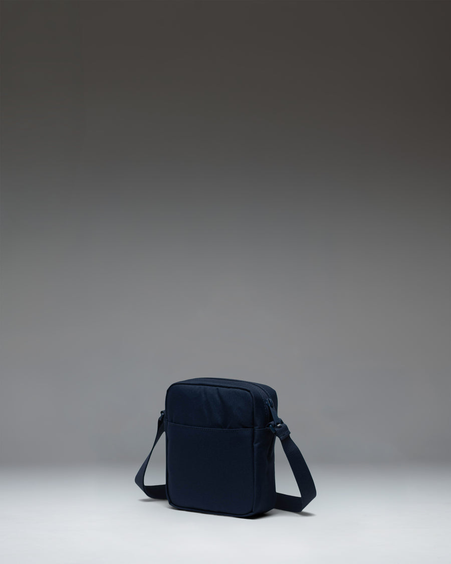 Herschel Heritage Crossbody bag in navy blue.