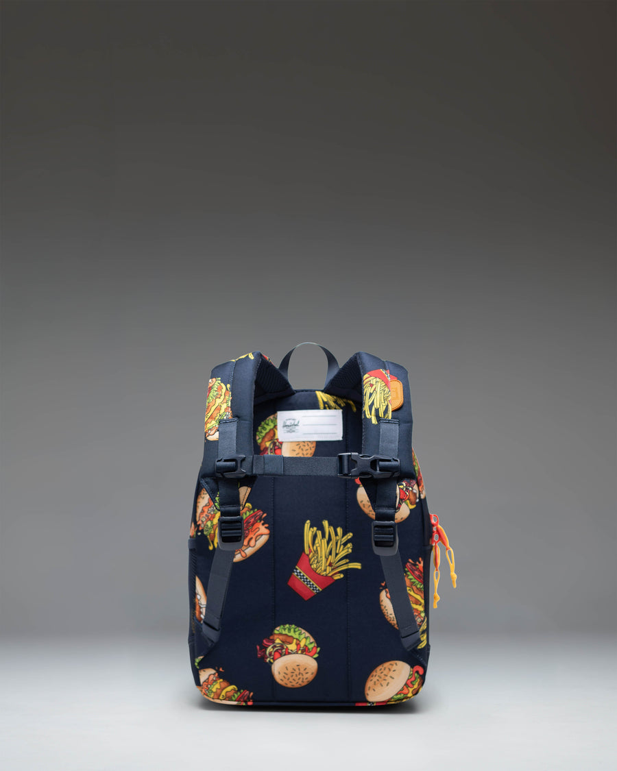 Herschel Supply Co. Heritage Kids backpack in a dual-tone design featuring a primary bold color body with contrasting front pocket and straps.
