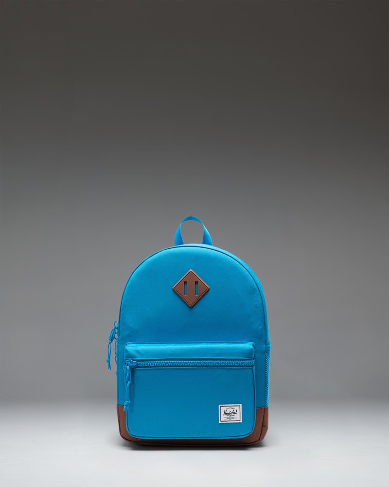 Herschel Heritage Kids Backpack in Hawaiian Surf blue with a Saddle Brown diamond accent and base.
