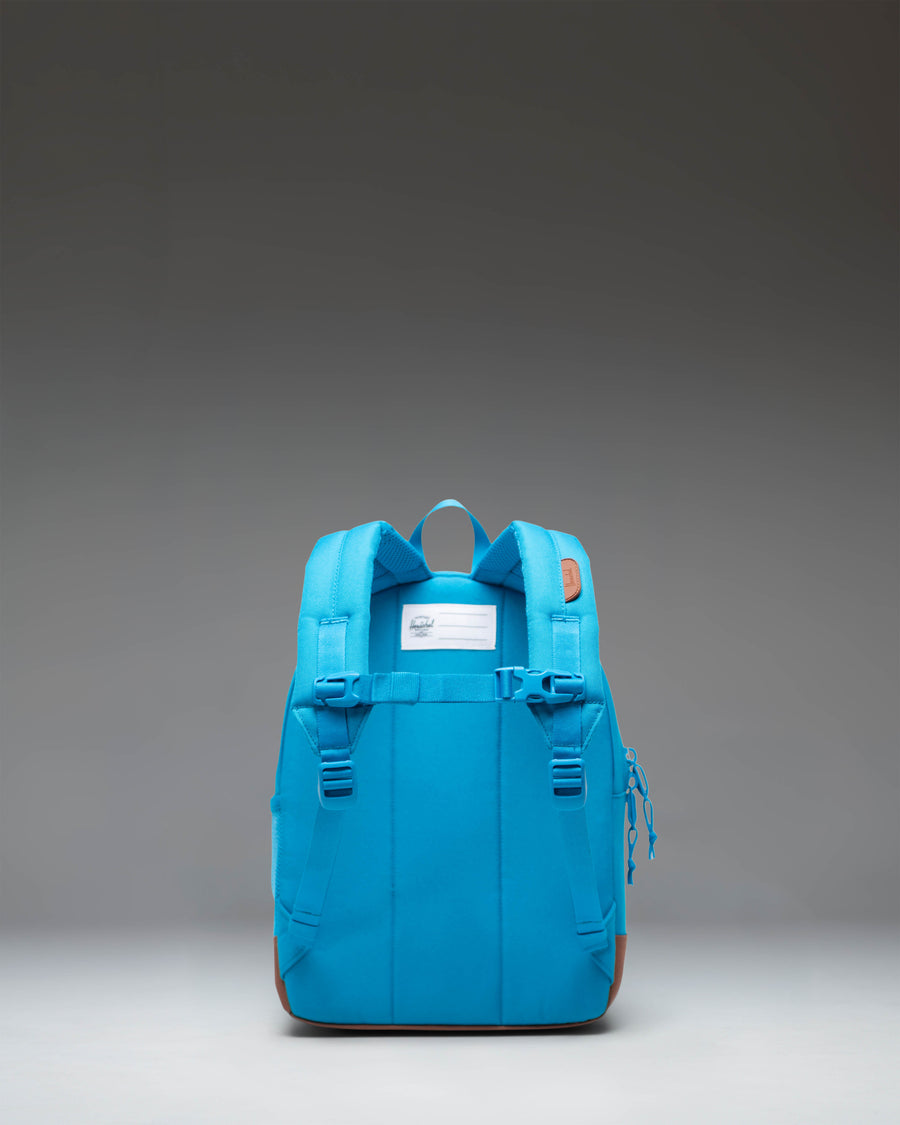 Herschel Heritage Kids Backpack in Hawaiian Surf turquoise and saddle brown, featuring padded shoulder straps and a front storage pocket.