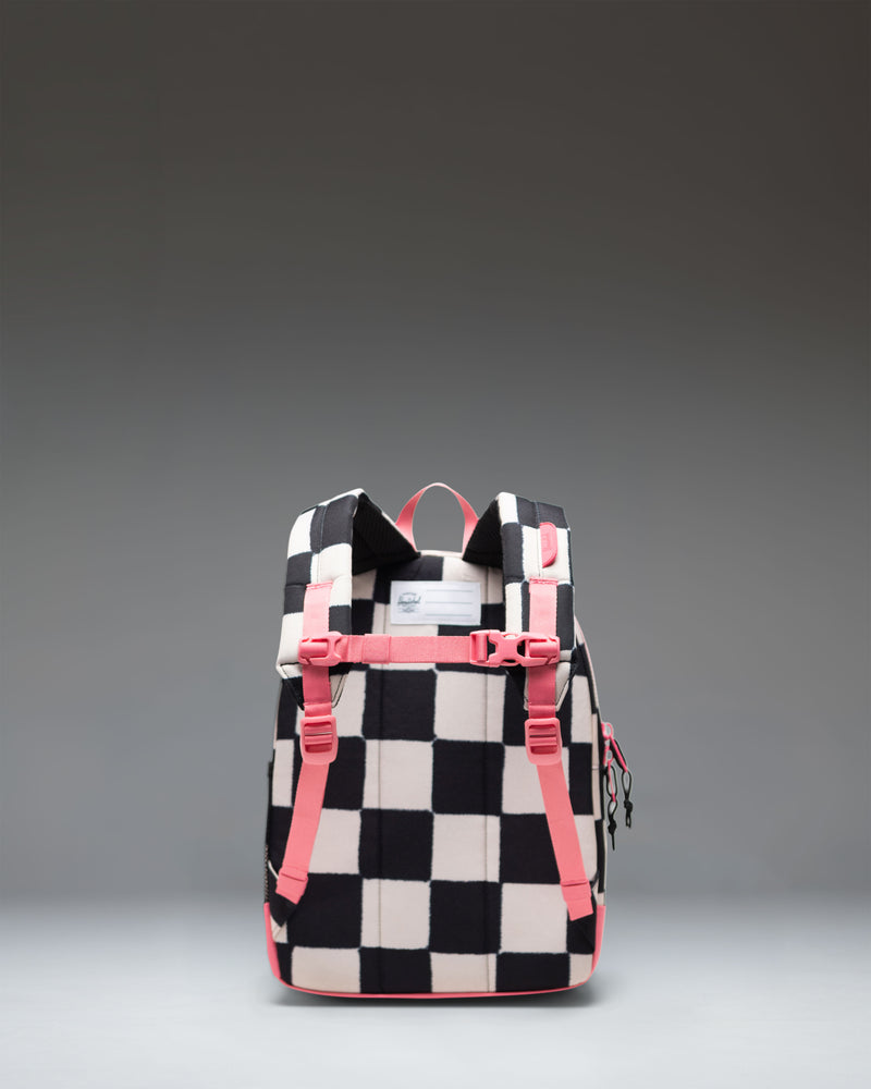 Herschel Heritage Kids Backpack in Check This Confetti colorway, featuring a black base with a vibrant colorful confetti pattern.
