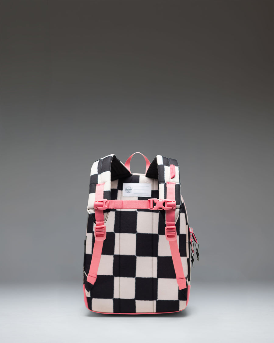 Herschel Heritage Kids Backpack in Check This Confetti colorway, featuring a black base with a vibrant colorful confetti pattern.