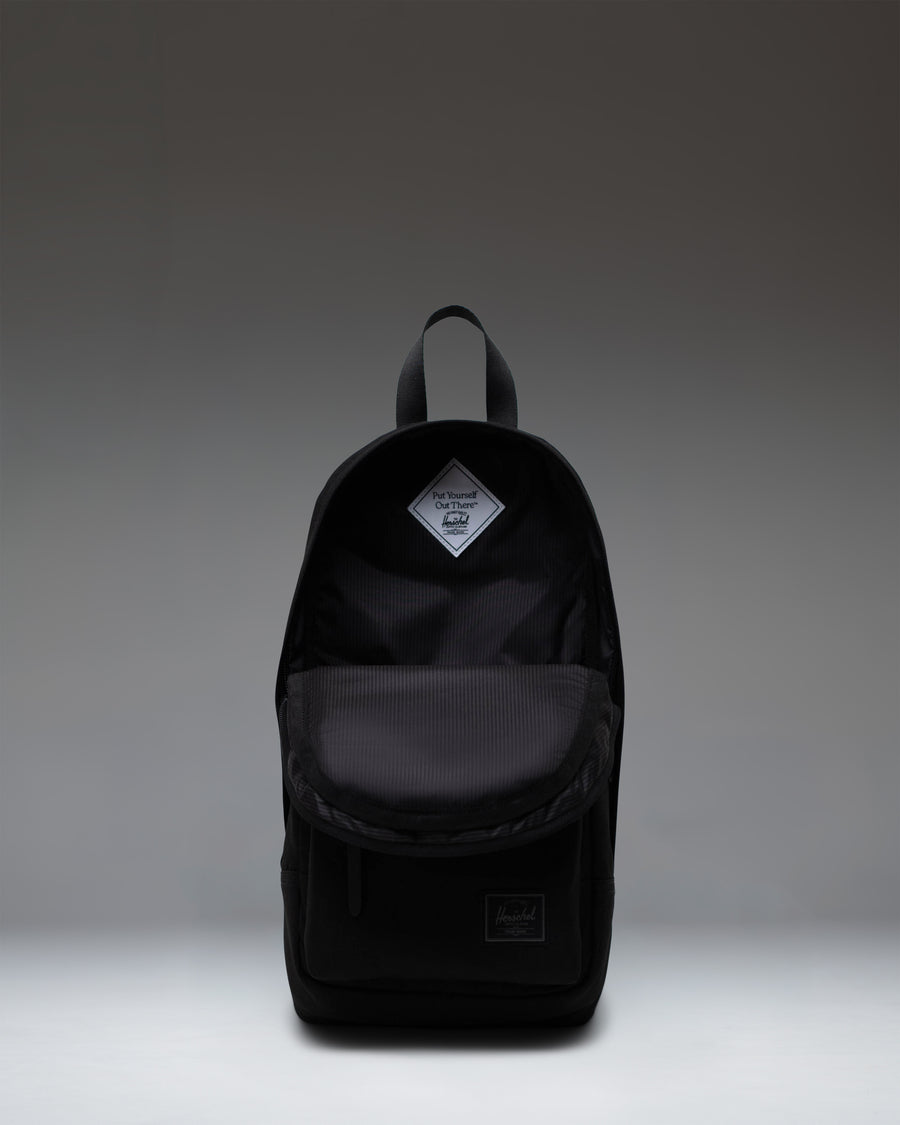 Herschel Heritage Shoulder Bag in Black Tonal, showing a front view of the compact crossbody design.