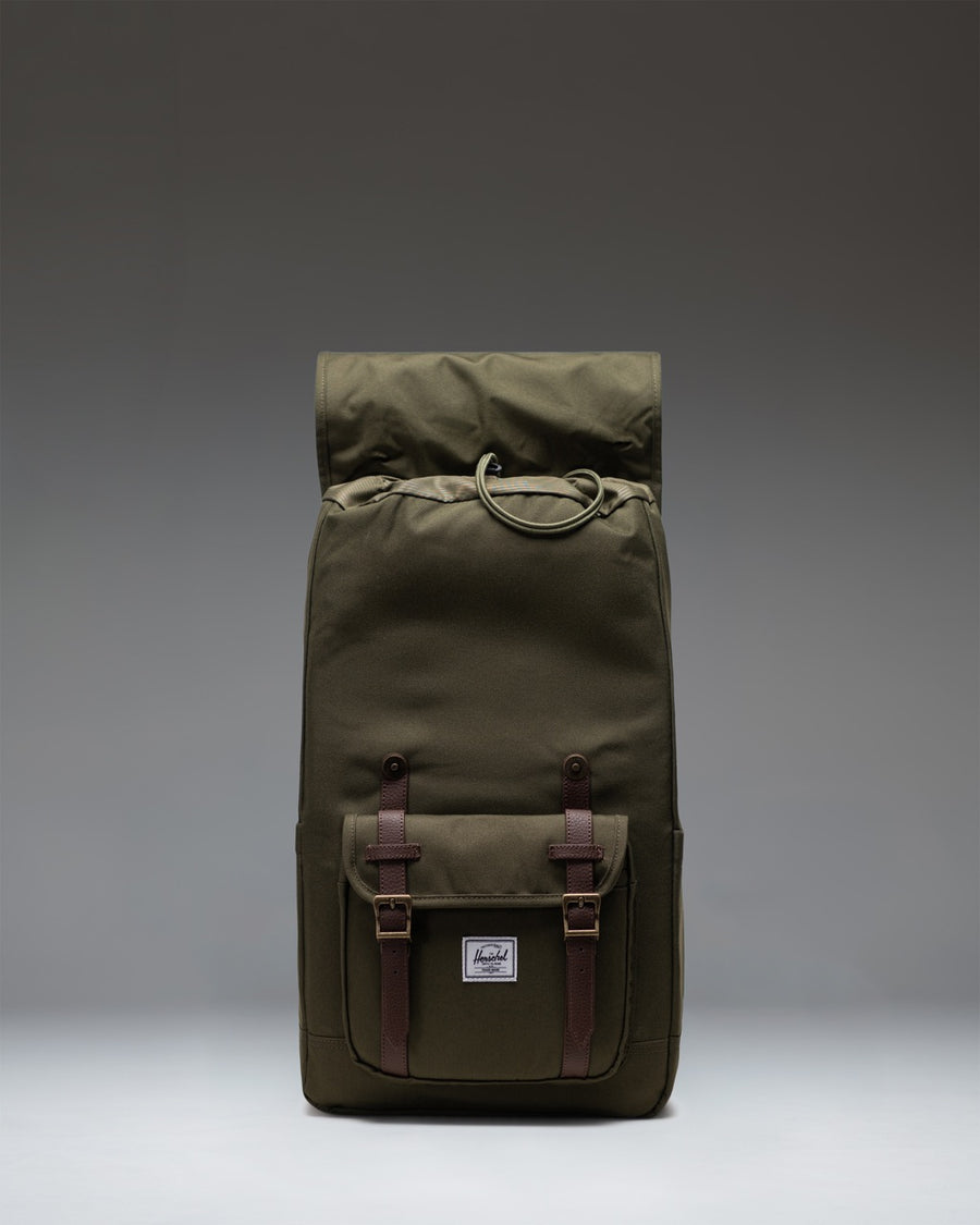 Herschel Little America Backpack in Ivy Green featuring classic mountaineering style, dual water bottle pockets, and black rubber straps.