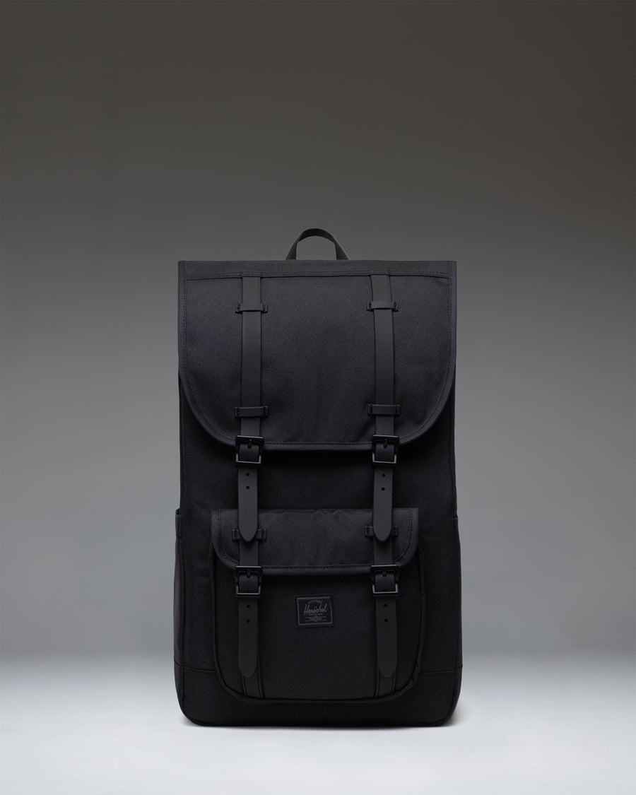 Herschel Little America Backpack in Black Tonal with black straps and front storage pocket.