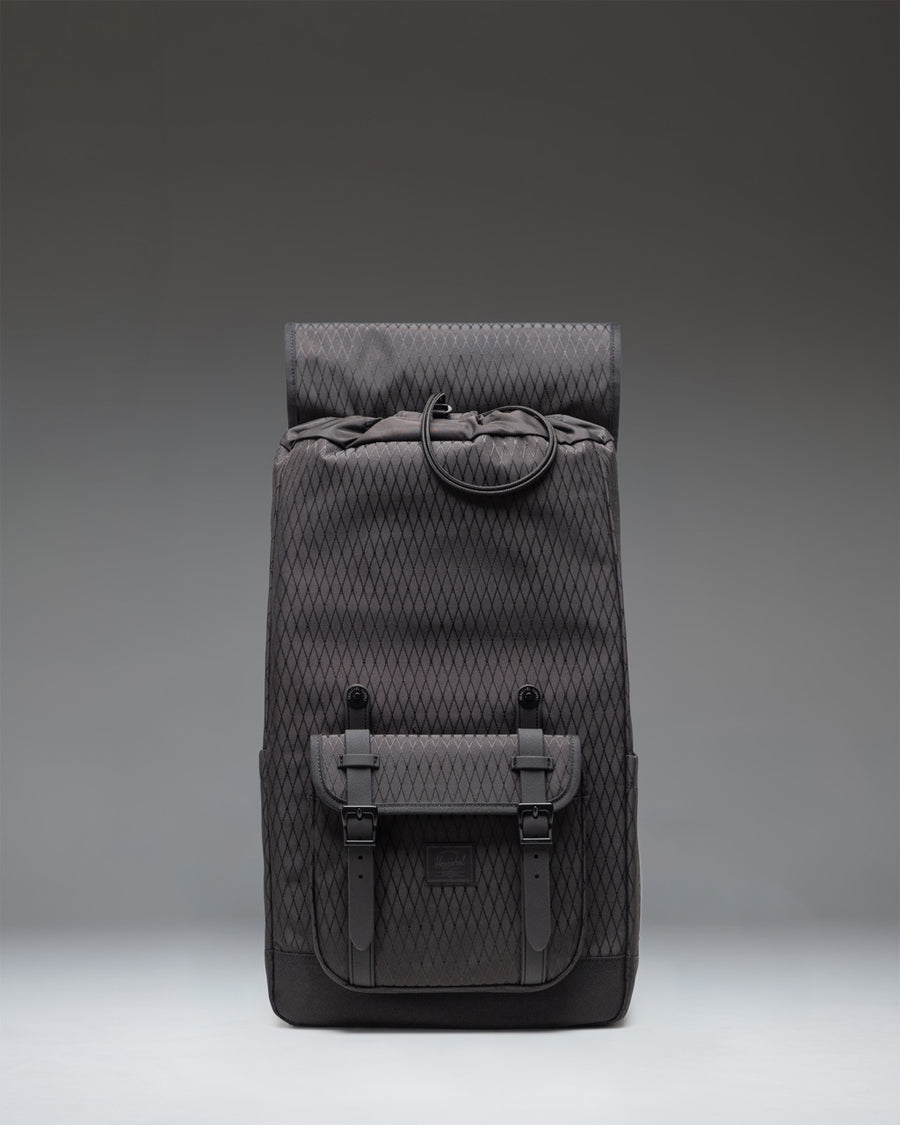 Herschel Little America backpack in Black Diamond/Black featuring a subtle diamond-textured weave and classic mountaineering-style strap closures.