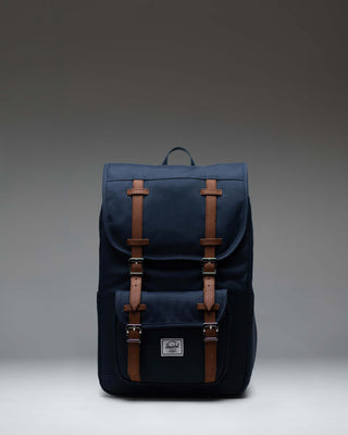 Herschel Little America Mid Backpack in Navy, lifestyle view on a model.