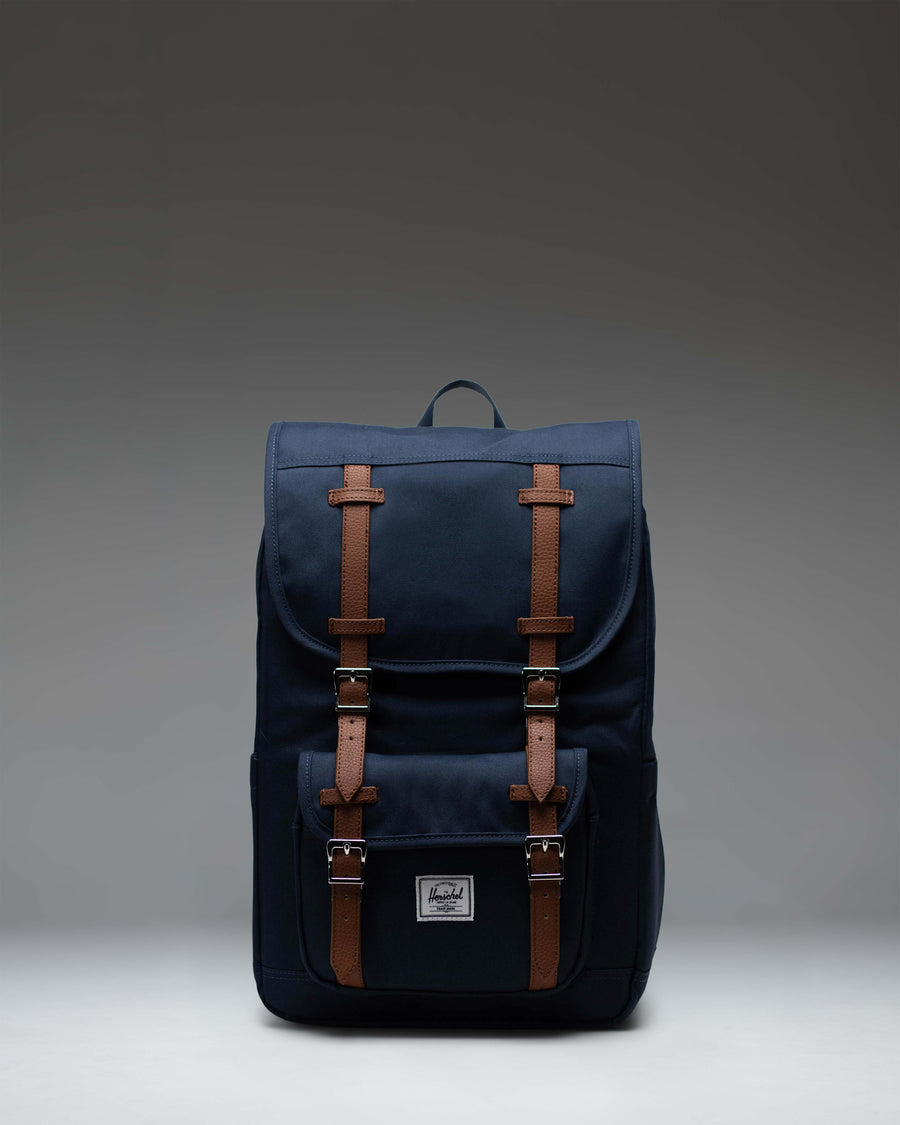 Herschel Little America Mid Backpack in Navy, lifestyle view on a model.