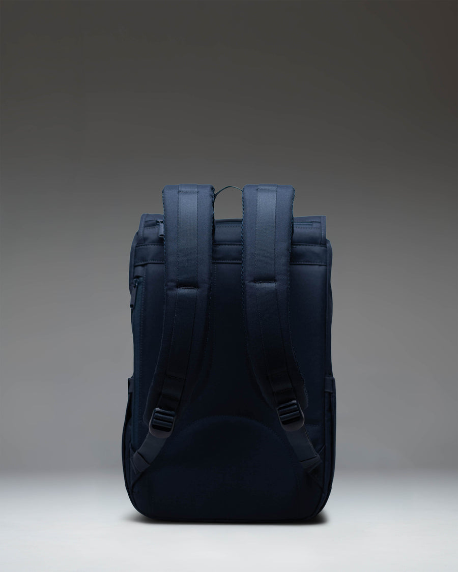 Herschel Supply Co. Little America Mid-Volume backpack in classic navy blue featuring adjustable front straps and a compact design.