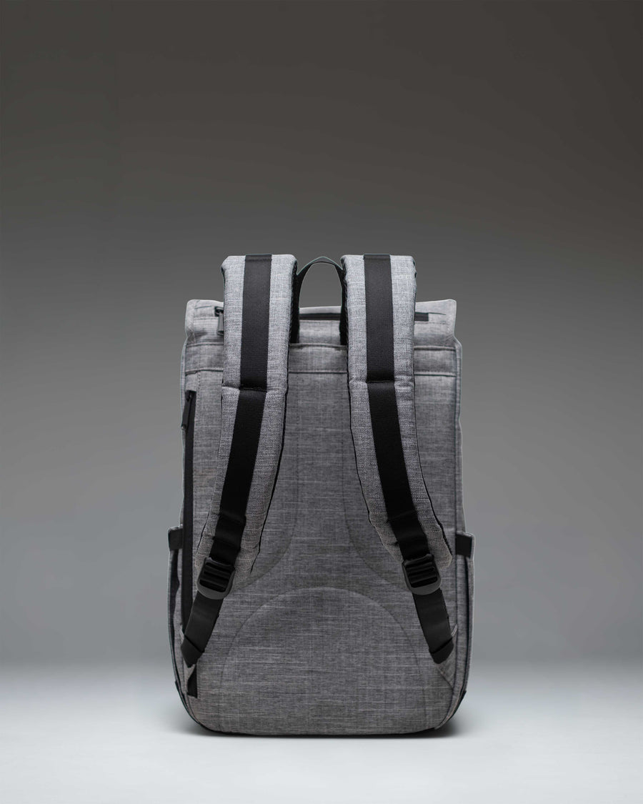 Herschel Little America Mid Backpack in Raven Crosshatch grey, showing its iconic mountain style design with two front magnetic strap closures.