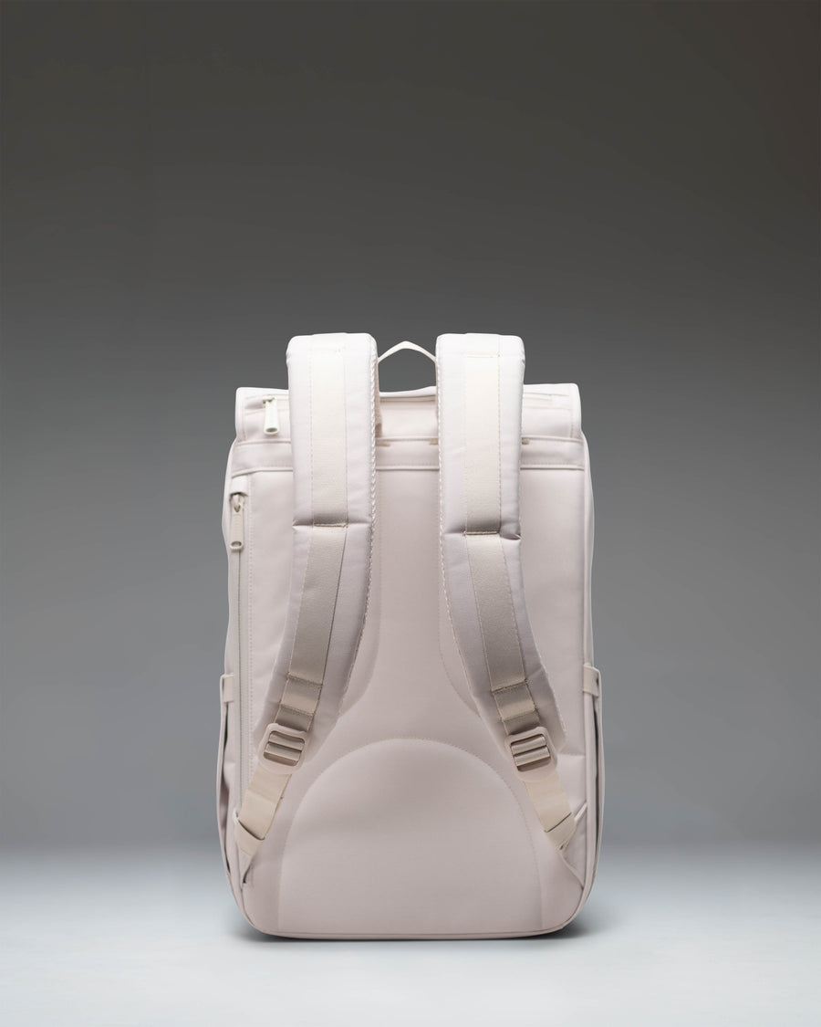 Herschel Little America Mid Backpack in Moonbeam, a neutral light beige everyday bag with rubber strap closures.