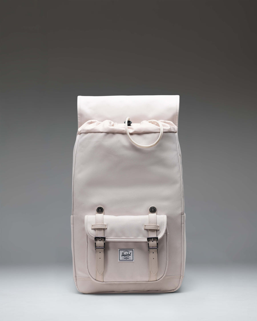 Herschel Little America Mid Backpack in Moonbeam beige featuring a classic mountaineering design with dual rubber straps and a front pocket.