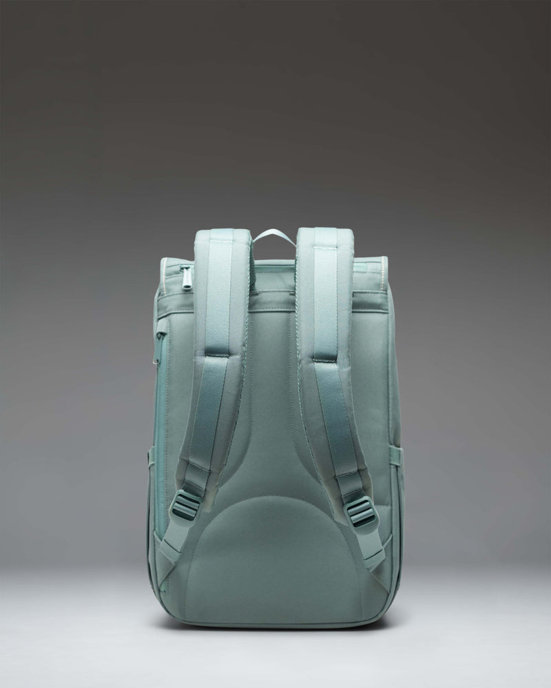 Herschel Little America Mid Backpack showcasing its classic mountaineering design, dual magnetic straps, and front storage pocket.