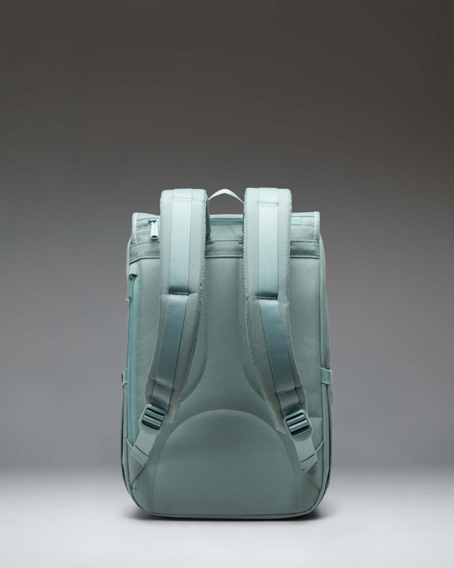 Herschel Little America Mid Backpack showcasing its classic mountaineering design, dual magnetic straps, and front storage pocket.