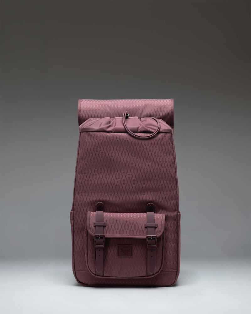 Herschel Little America Mid Backpack in Huckleberry Diamond, featuring a purple geometric pattern, brown rubber straps, and front pocket.