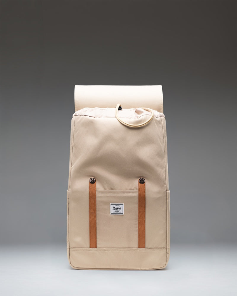 Herschel Supply Co. Retreat Backpack in Eucalyptus green with brown magnetic strap closures and a front storage sleeve.