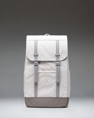Herschel Retreat Backpack in Vapor Diamond and Charcoal Gray, featuring dual rubber straps, a front storage sleeve, and a woven logo label.