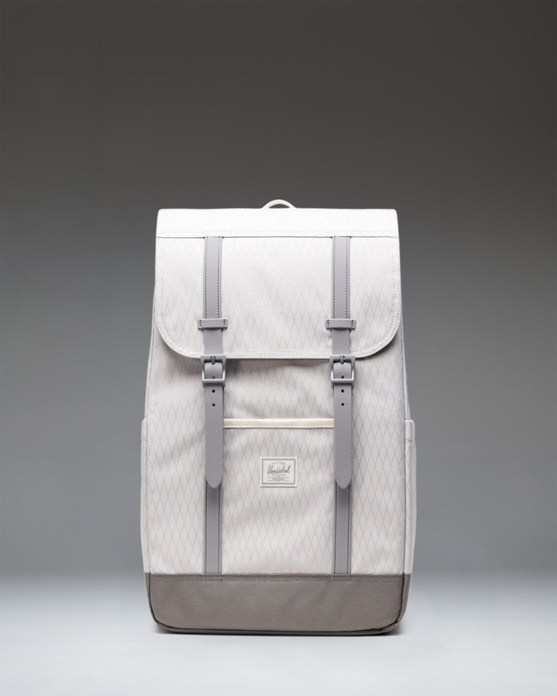 Herschel Retreat Backpack in Vapor Diamond and Charcoal Gray, featuring dual rubber straps, a front storage sleeve, and a woven logo label.