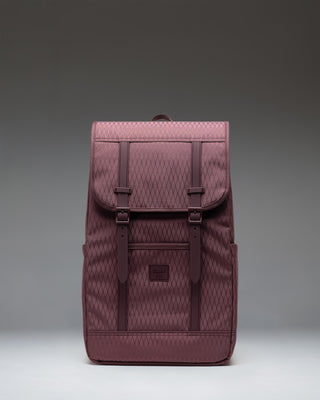 Herschel Retreat Backpack in Huckleberry Diamond, a deep purple and green diamond pattern, shown from the front.