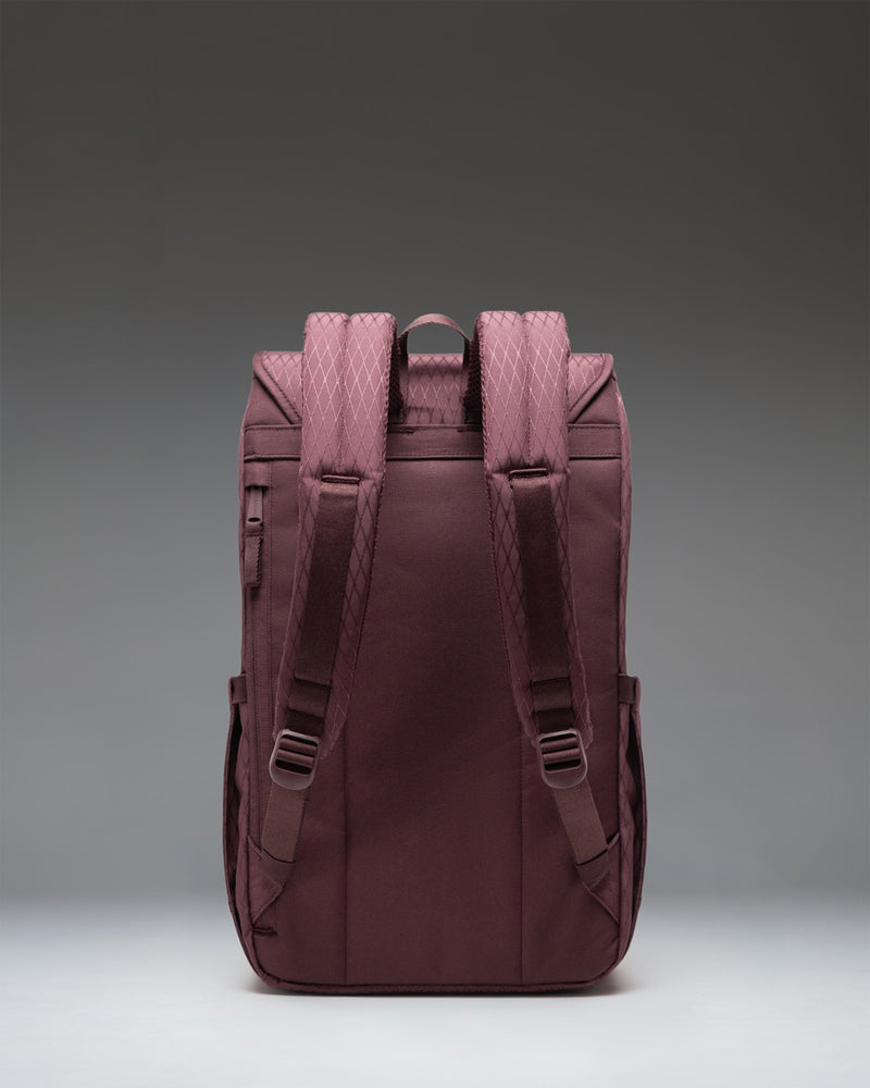 Herschel Retreat Backpack in Huckleberry Diamond featuring a purple geometric pattern, brown rubber straps, and a classic woven label.