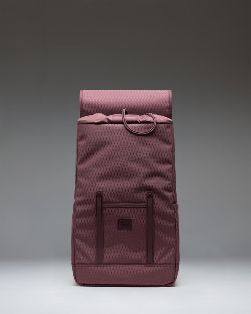 Herschel Retreat Backpack in Huckleberry Diamond, a purple daily laptop backpack featuring a top flap with strap closures.