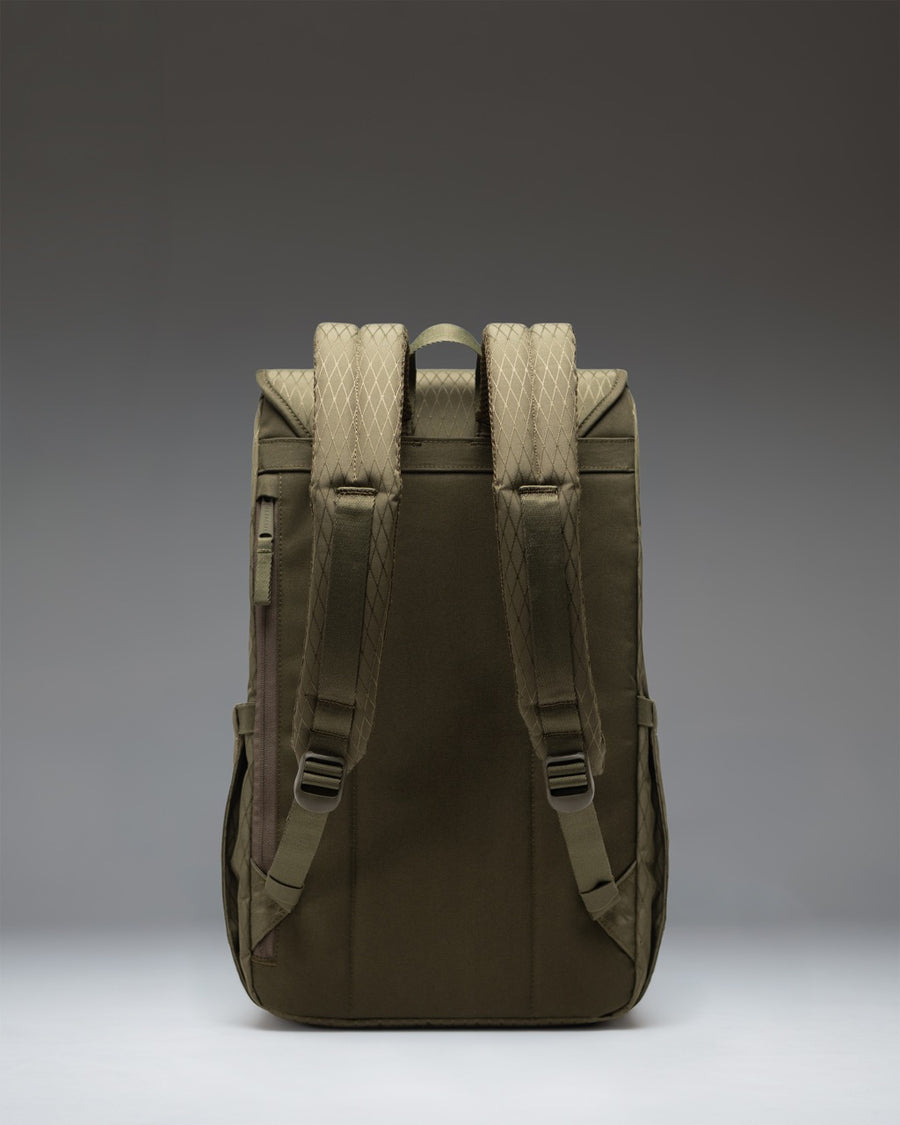 Herschel Retreat Backpack in Ivy Green Diamond featuring a classic cinch top design and brown synthetic leather strap closures.