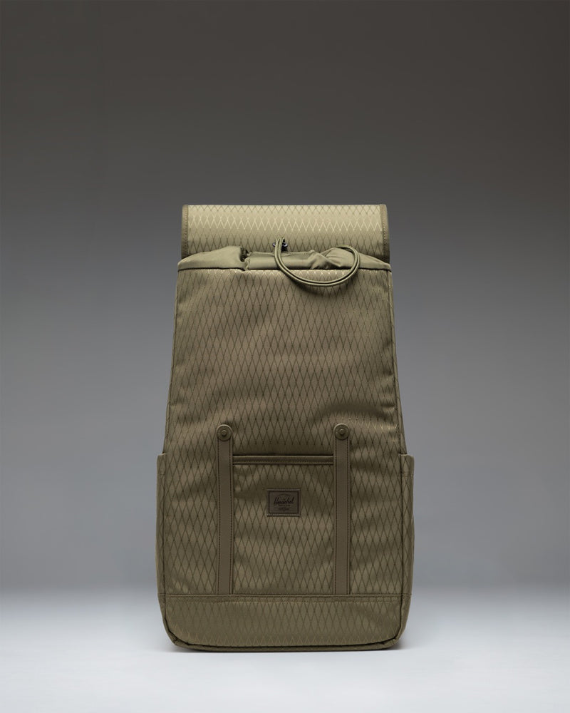 Herschel Retreat Backpack in Ivy Green Diamond, featuring a classic design with front strap closures.