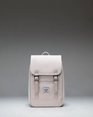 Herschel Retreat Mini Backpack in Moonbeam colorway, featuring a front storage sleeve and magnet fastened straps.