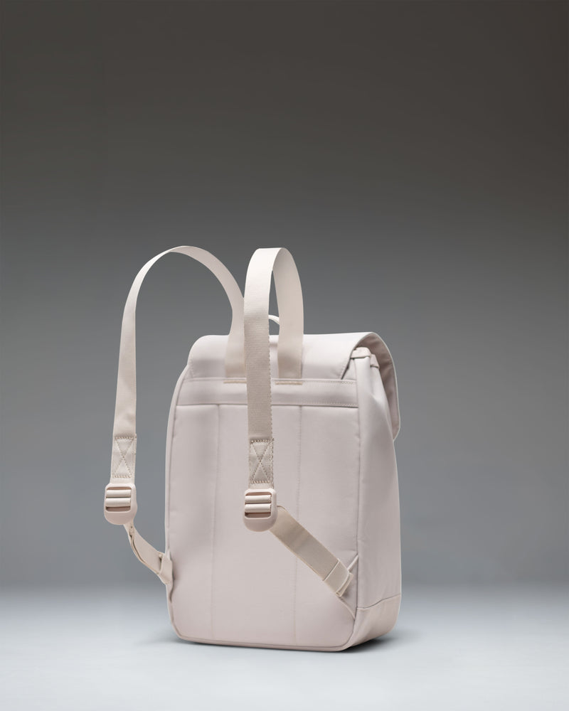 Herschel Retreat Mini Backpack in Moonbeam white, showing a clean front view with a single strap closure and a classic woven label.