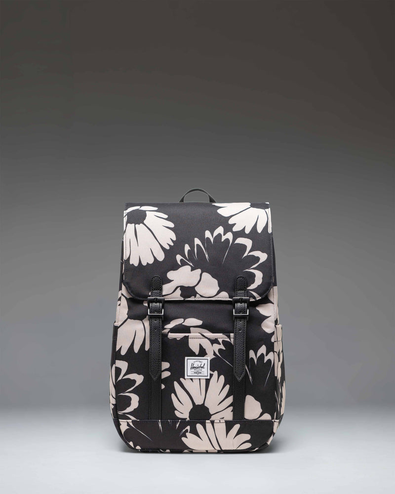 Herschel Retreat Small Backpack in Graphic Daisy - Moonbeam, featuring a floral print and front strap closures.
