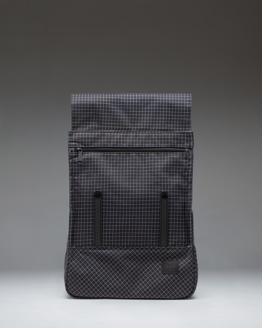 Herschel Survey Backpack in Grid Black featuring a sleek, minimalist design with matte coating and dual strap closures.