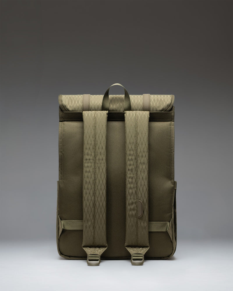 Herschel Survey Backpack in Ivy Green Diamond featuring a minimalist design, a clip-fastened flap closure, and a hidden zippered storage sleeve.