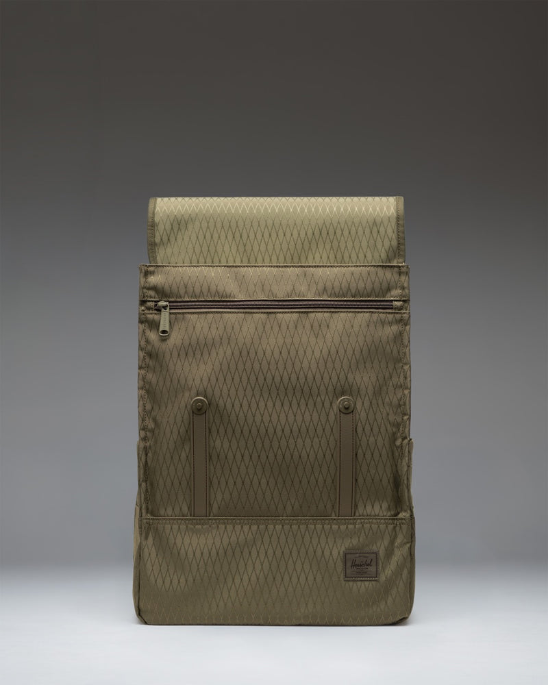 Herschel Survey Backpack in Ivy Green Diamond featuring a minimalist design, magnetic strap closures, and a front sleeve pocket.