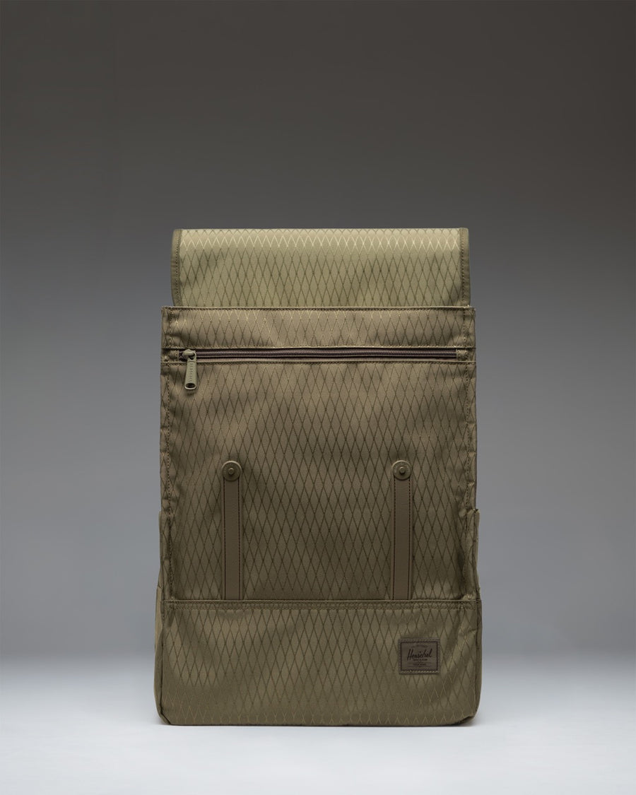 Herschel Survey Backpack in Ivy Green Diamond featuring a minimalist design, magnetic strap closures, and a front sleeve pocket.