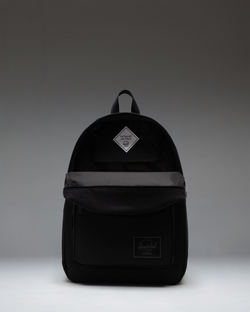 Herschel Supply Co. Pop Quiz Backpack in Black Tonal, showing the classic design with front pocket and clean minimalist styling.