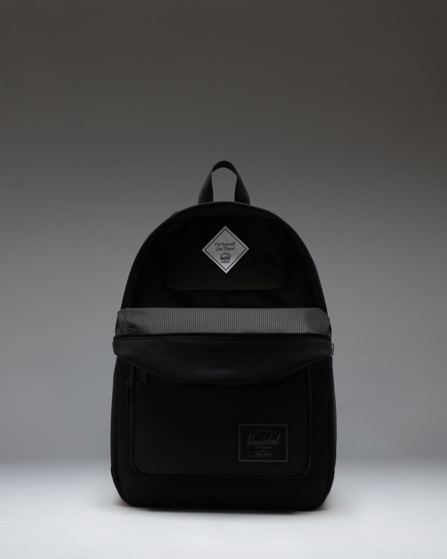 Herschel Supply Co. Pop Quiz Backpack in Black Tonal, showing the classic design with front pocket and clean minimalist styling.
