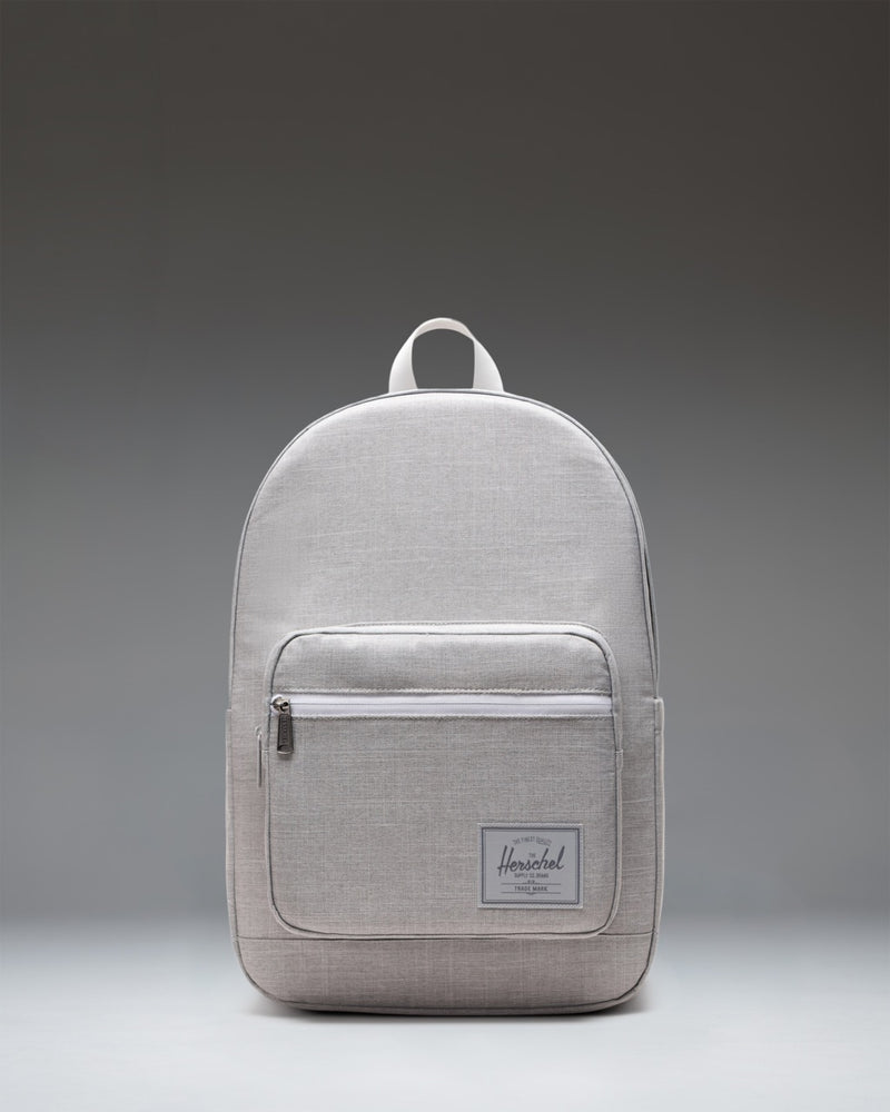 Herschel Supply Co. Pop Quiz Backpack in Grey Crosshatch, showing the front view with a brown zipper detail and a white logo patch.
