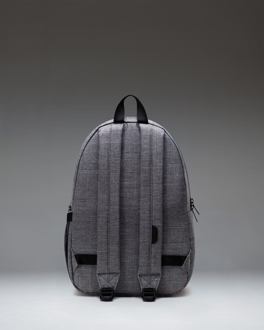 Herschel Supply Co. Settlement Backpack in Raven Crosshatch grey, showing the back panel, padded shoulder straps, and top handle.